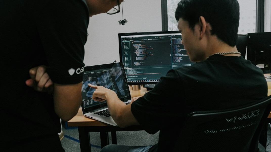 diverse team collaborating on code